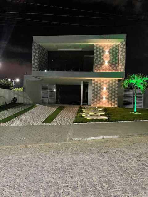Residência duplex · Alphaville · Revestimento 3D e iluminação noturna
